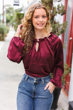 Load image into Gallery viewer, Holiday Vibes Frill Detail Tie Neck Satin Top in Burgundy