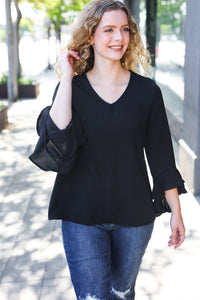 Falling In Love Hi-Lo Ruffle Sleeve Woven Top in Black