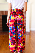 Load image into Gallery viewer, Vacay Vibes Smocked Waist Side Slit Palazzo Pants in Kaleidoscope
