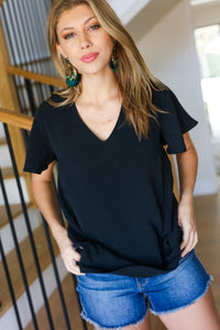 Flaunting the Flutter Sleeve V Neck Top in Black