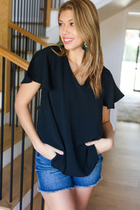 Flaunting the Flutter Sleeve V Neck Top in Black