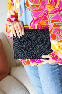 Raffia Woven Wrist Strap Clutch Bag in Black