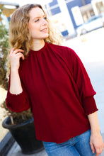 Load image into Gallery viewer, Bold Dreams Smocked Three Quarter Sleeve Tie Back Top in Wine
