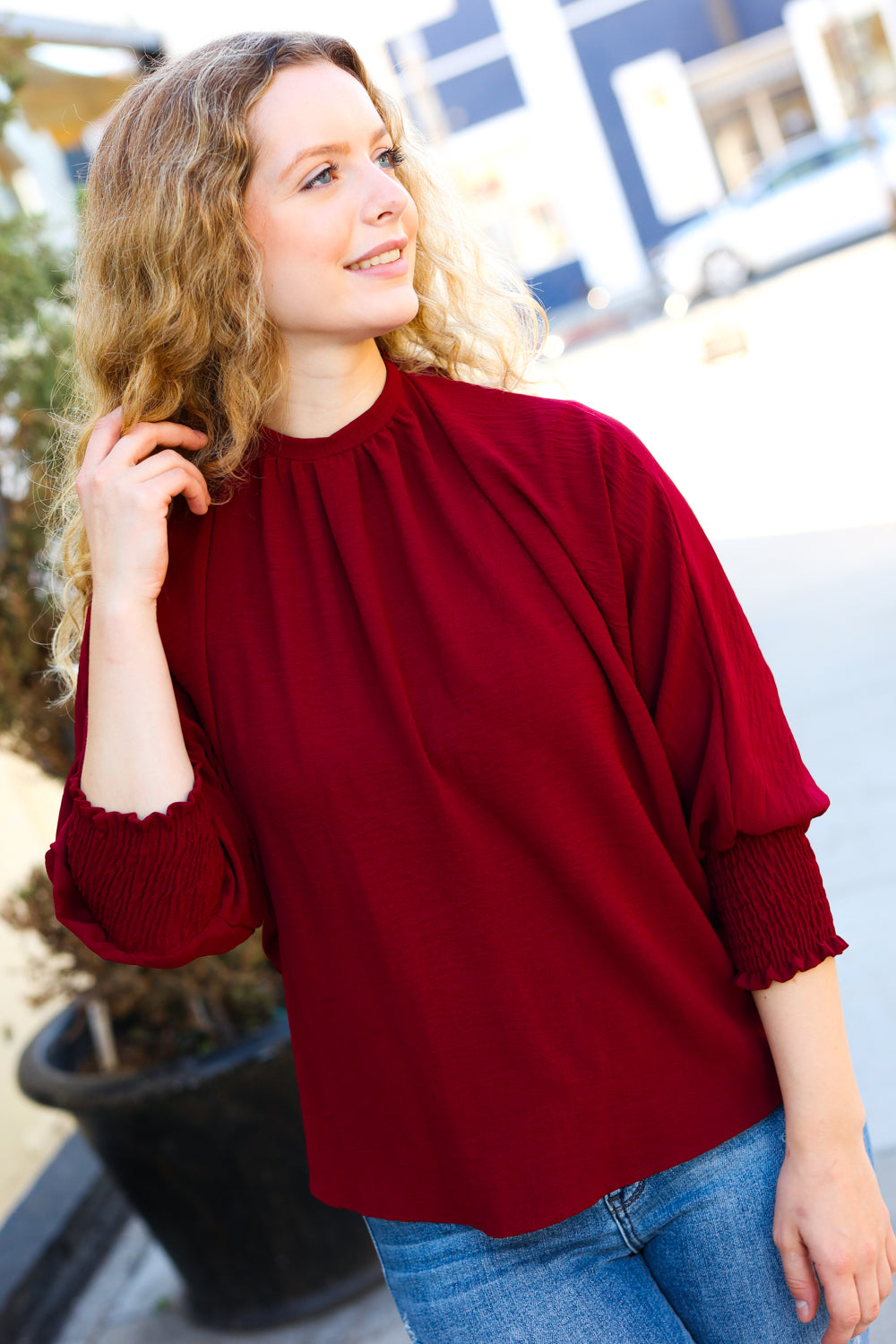 Bold Dreams Smocked Three Quarter Sleeve Tie Back Top in Wine