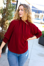 Load image into Gallery viewer, Bold Dreams Smocked Three Quarter Sleeve Tie Back Top in Wine
