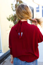 Load image into Gallery viewer, Bold Dreams Smocked Three Quarter Sleeve Tie Back Top in Wine
