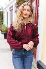 Load image into Gallery viewer, Holiday Vibes Frill Detail Tie Neck Satin Top in Burgundy
