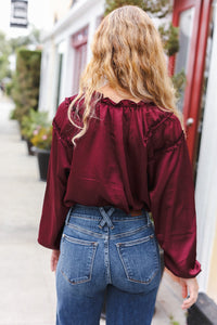 Holiday Vibes Frill Detail Tie Neck Satin Top in Burgundy