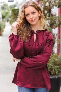 Holiday Vibes Frill Detail Tie Neck Satin Top in Burgundy