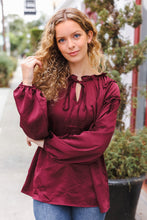 Load image into Gallery viewer, Holiday Vibes Frill Detail Tie Neck Satin Top in Burgundy
