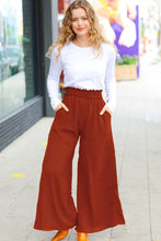 Load image into Gallery viewer, Relaxed Fun Smocked Waist Palazzo Pants in Rust
