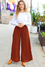 Load image into Gallery viewer, Relaxed Fun Smocked Waist Palazzo Pants in Rust
