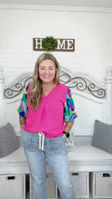 Load and play video in Gallery viewer, Tell Your Story Fuchsia Geo Print Puff Sleeve V Neck Top
