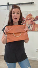 Load and play video in Gallery viewer, Ballerina Fold Over Gold O-Ring Faux Leather Clutch in Burnt Sienna

