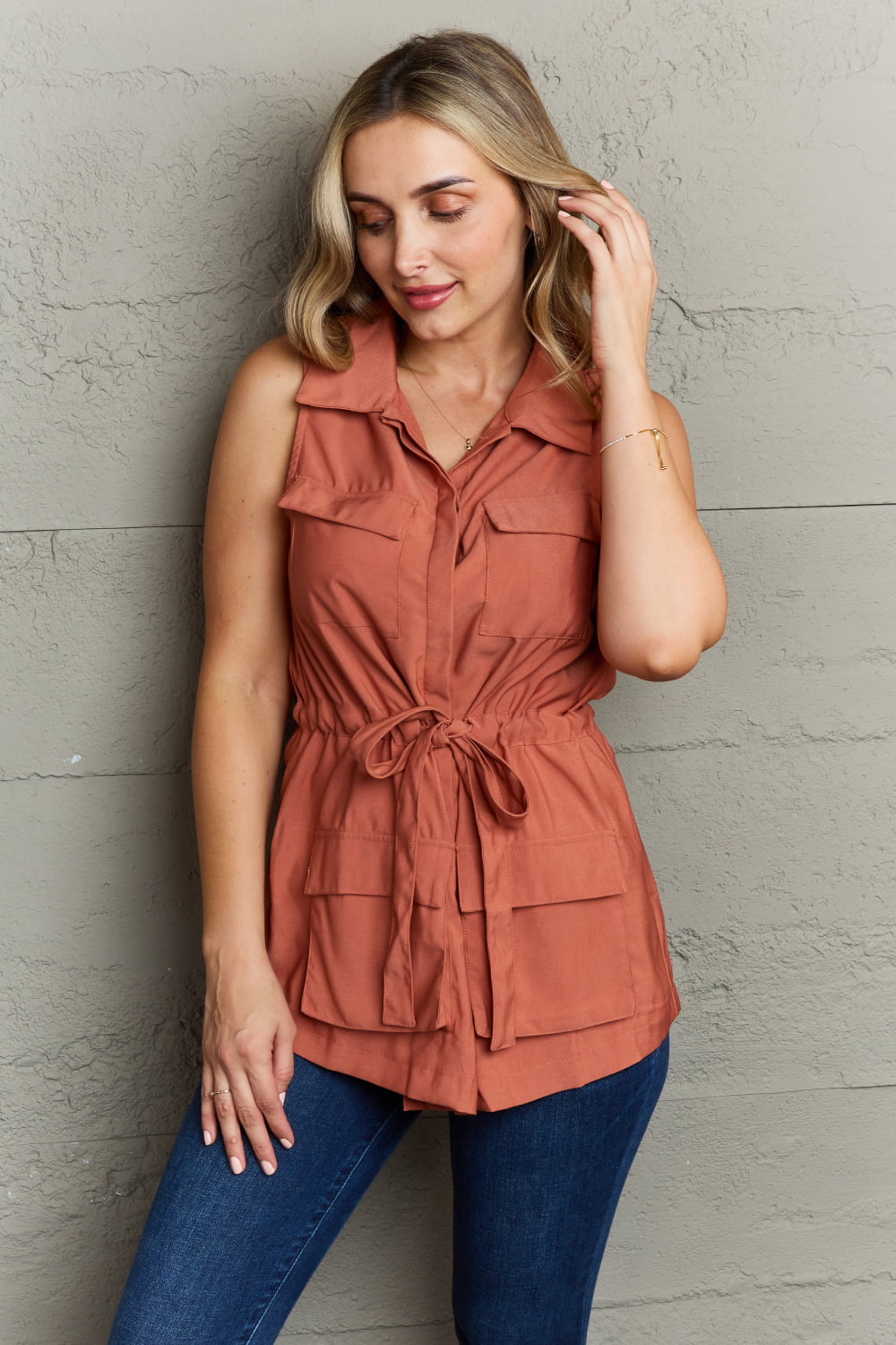 Follow The Light Sleeveless Collared Button Down Top in Brick Red