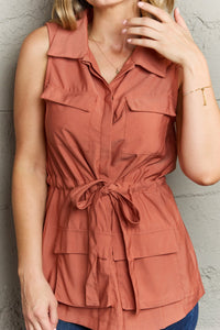 Follow The Light Sleeveless Collared Button Down Top in Brick Red
